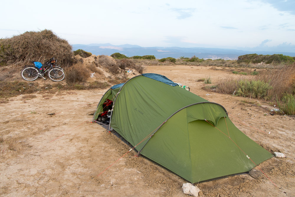 Camping on sand dunes may seem idyllic. However, we were attacked by sand flies and we soon found out that the bush we'd used to prop our bikes on was used by the beach-goers as a lavatory.