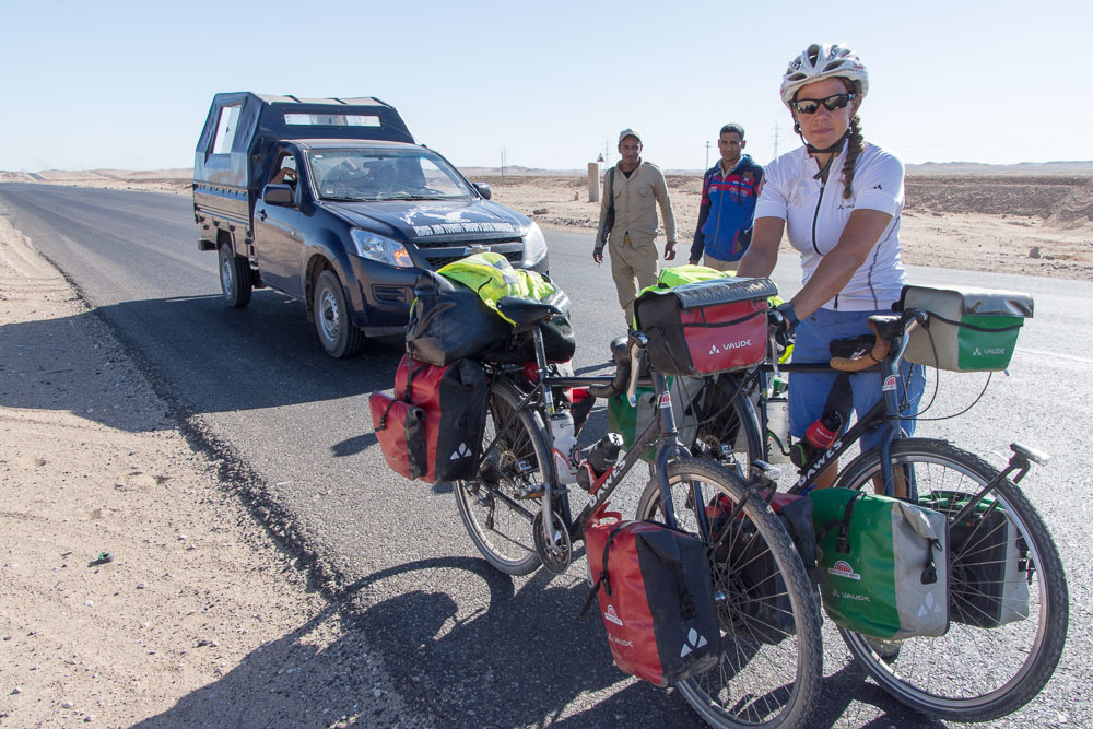 Our police kept a close eye on us as we changed a puncture - but gave up once we'd passed through Qena